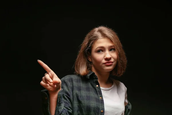 Emotional teenage girl on dark background — Stock Photo, Image