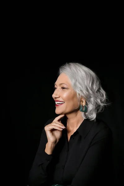 Portrait of stylish mature woman on dark background — Stock Photo, Image