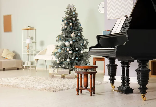 Grand piano in room decorated for Christmas