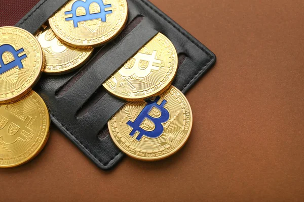 Wallet with bitcoins on color background — Stock Photo, Image