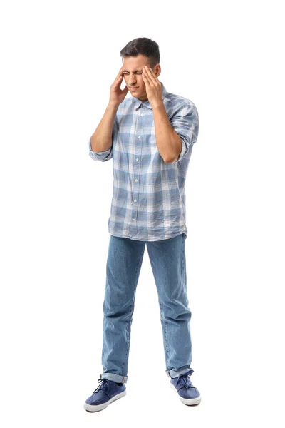 Portrait of handsome young man suffering from headache on white background — Stock Fotó