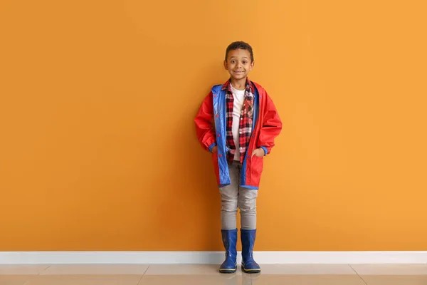 Fashionable African-American boy in autumn clothes near color wall — Stock Photo, Image