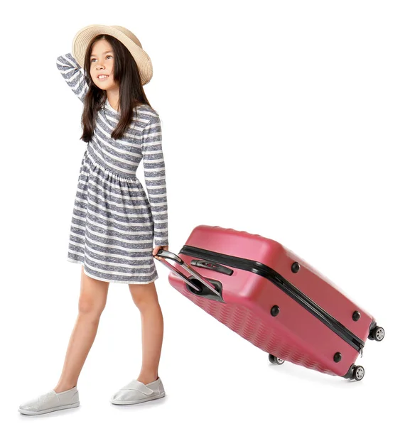 Cute girl with suitcase on white background — Stock Photo, Image