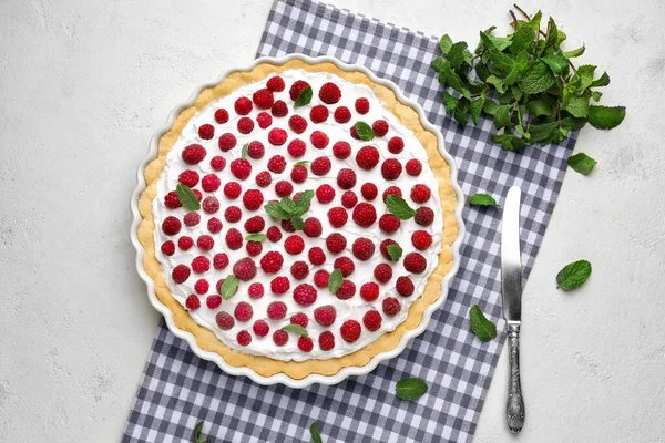 Tasty raspberry pie on table