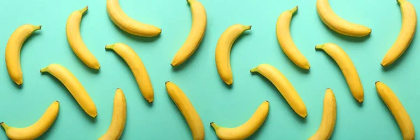 Many sweet ripe bananas on color background — Stock Photo, Image