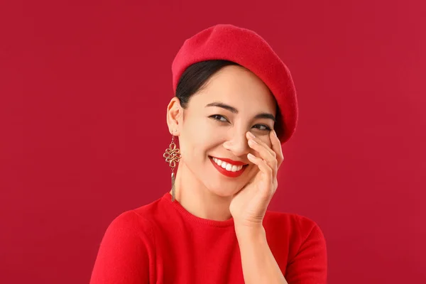 Fashionable Asian woman on color background — Stock Photo, Image