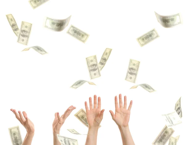 Mani femminili con banconote in dollaro in caduta su sfondo bianco — Foto Stock