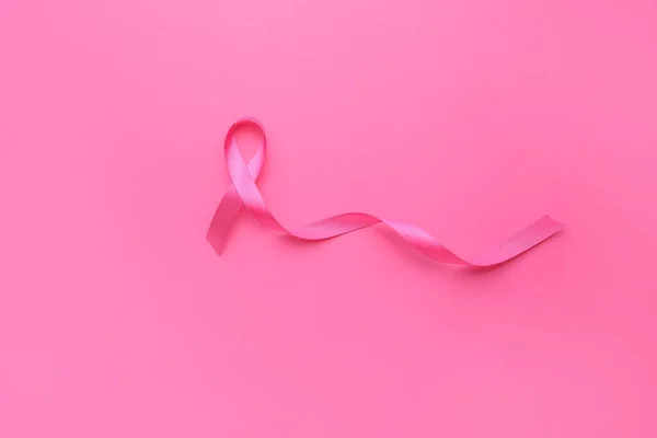 Pink ribbon on color background. Cancer awareness concept — Stock Photo, Image