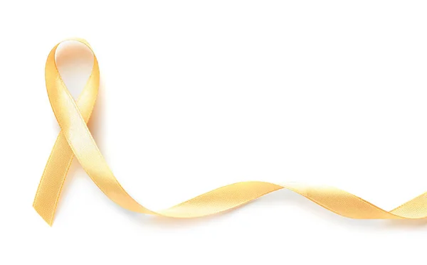 Golden ribbon on white background. Cancer awareness concept — Stock Photo, Image