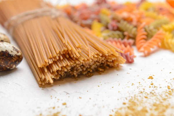 Uncooked pasta on white background, closeup — Stock Photo, Image