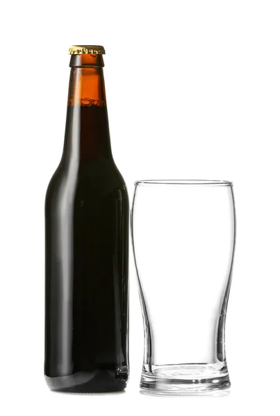 Bottle of fresh beer and empty glass on white background — Stock Photo, Image