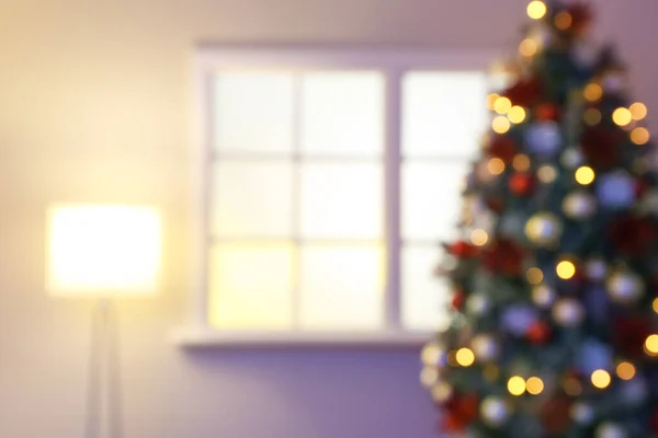 Decorated Christmas tree in room, blurred view — ストック写真