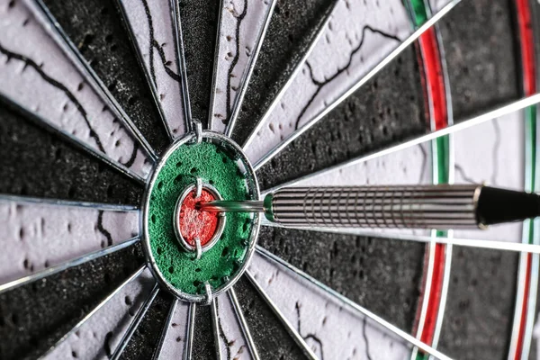 Dartboard with hit bullseye, closeup — Stock Photo, Image