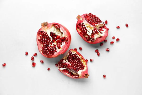 Ripe juicy pomegranates on white background — Stock Photo, Image