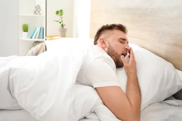 Morning of sleepy young man  in bed — Stock Photo, Image
