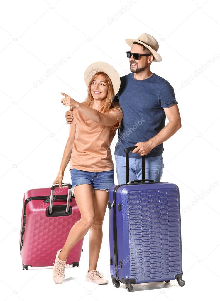 Couple with suitcases isolated on white