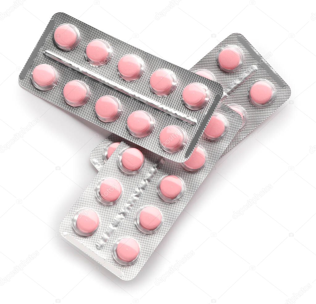 Blister packs with pills on white background