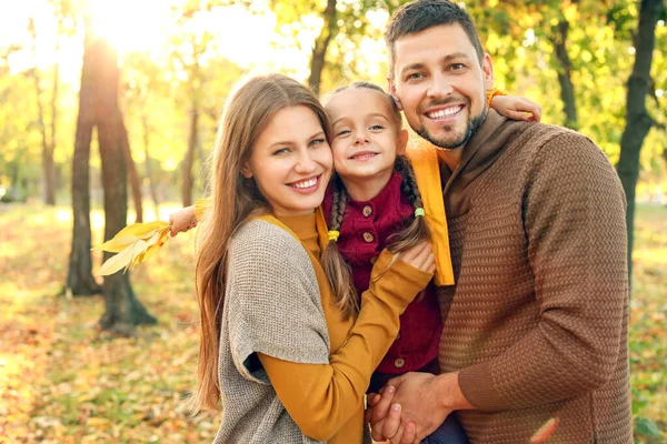 Happy family in autumn park — Stock Photo, Image