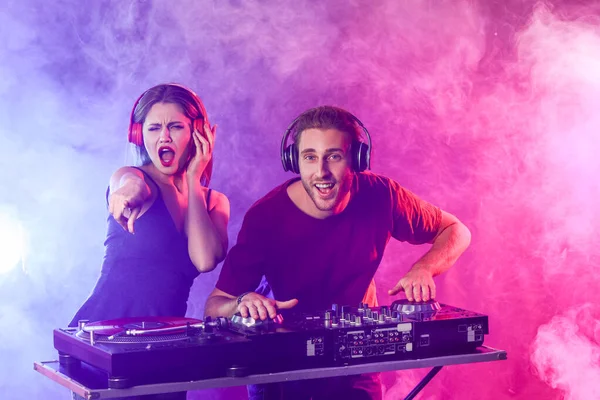 Young djs playing music in nightclub — Stock Photo, Image