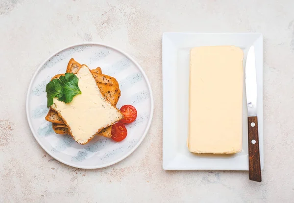 Composition with tasty bread and butter on table — Stock Photo, Image