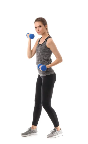 Sporty young woman with dumbbells on white background — Stock Photo, Image