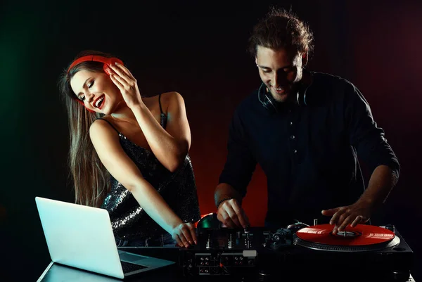 Young djs playing music in nightclub — Stock Photo, Image