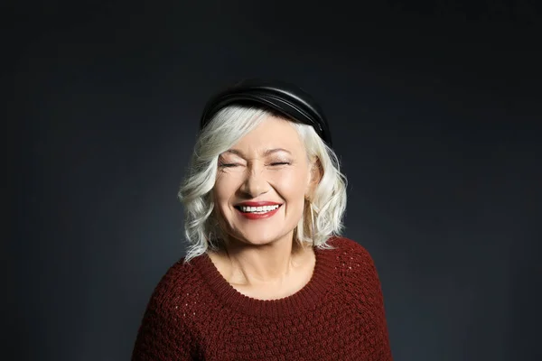 Portrait of stylish mature woman on dark background — Stock Photo, Image