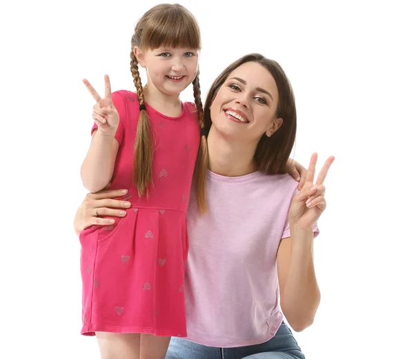 Portrait of happy mother and daughter showing victory gesture on white background — Stock Photo, Image