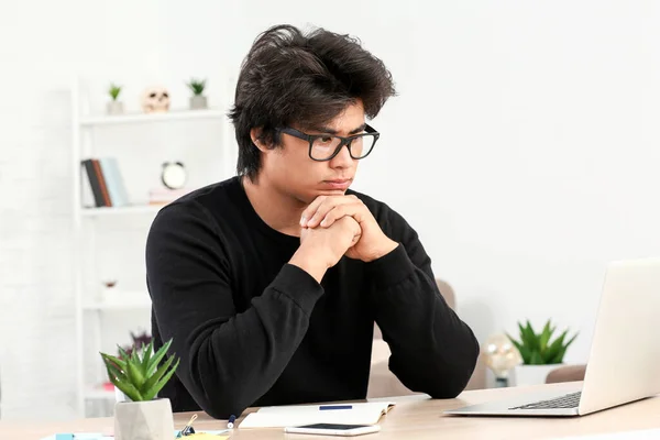 Asian programmer working on laptop in office — Stock Photo, Image