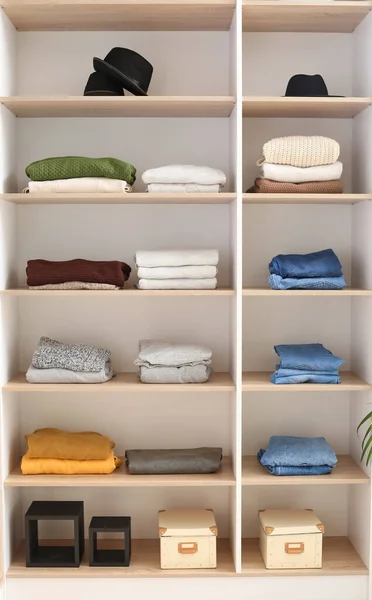 Wardrobe with stacks of clean clothes — Stock Photo, Image