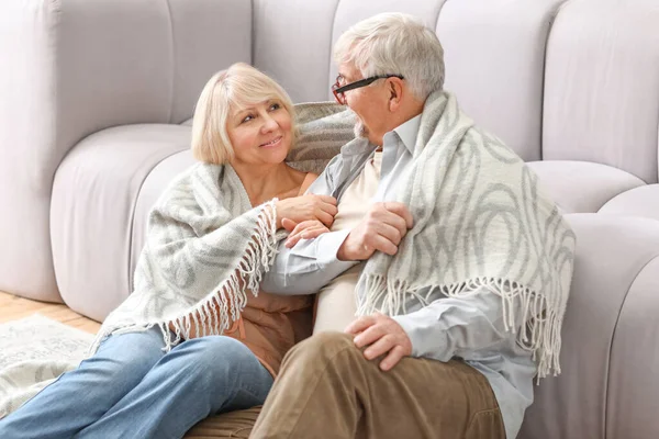 Happy mature couple resting together at home — Stock Photo, Image