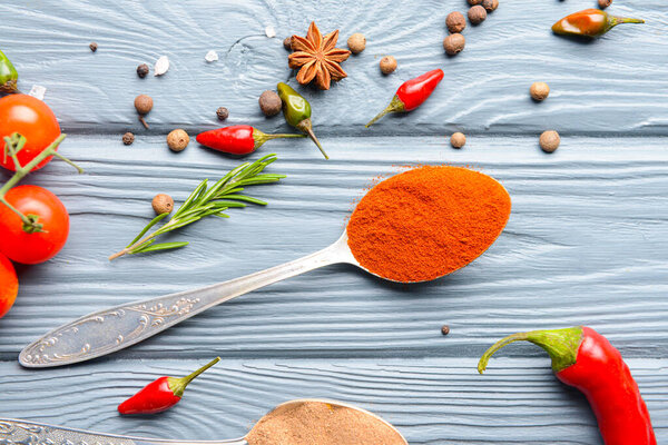 Different spices on wooden background