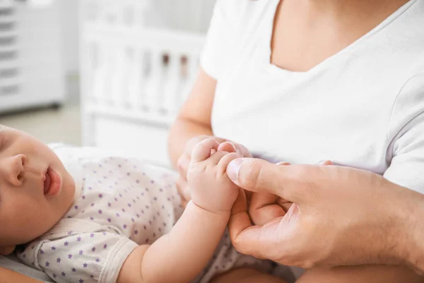 Young parents with newborn baby in maternity hospital, closeup — Stock Photo, Image