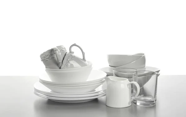 Set of clean tableware on white background — Stock Photo, Image