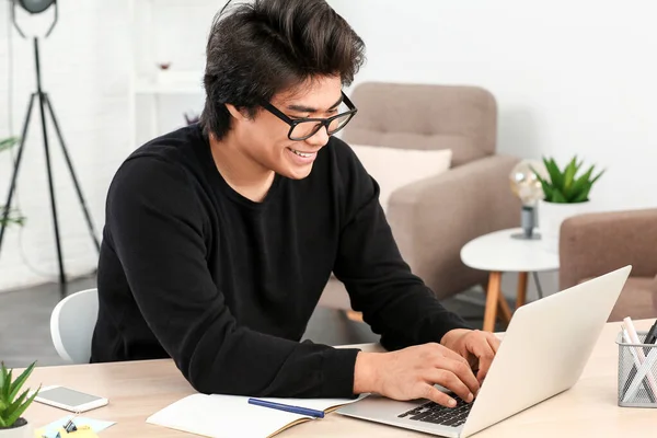 Asian programmer working on laptop in office — Stock Photo, Image