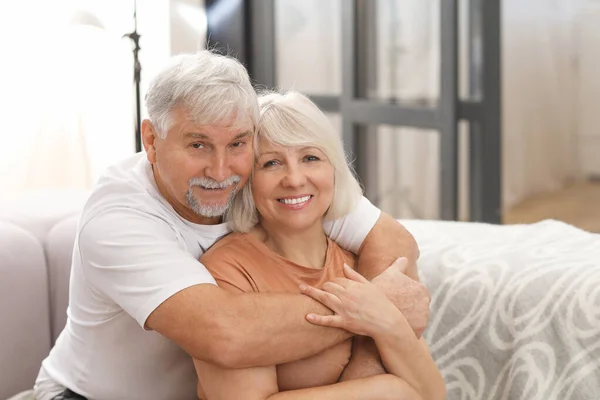 Happy mature couple at home