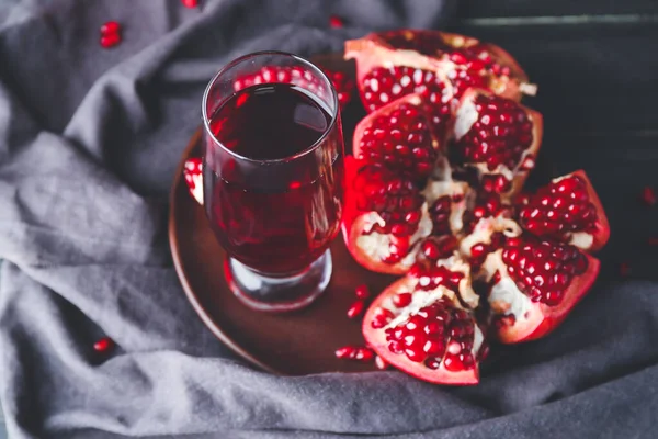 Glass of tasty pomegranate juice on table — Stock Photo, Image