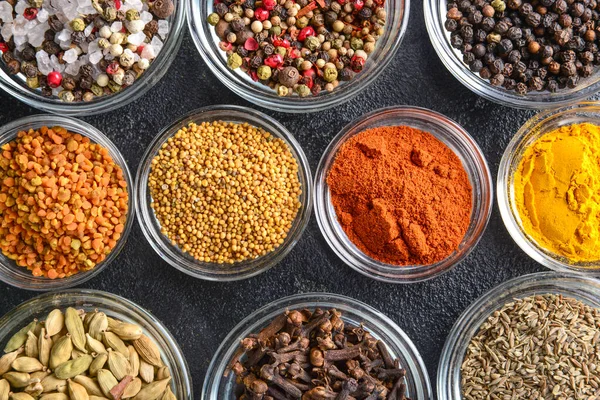 Bowls with many different spices on table — Stock Photo, Image