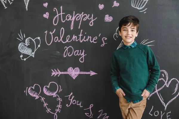 Cute little boy near dark wall. Valentines Day celebration — Stock Photo, Image