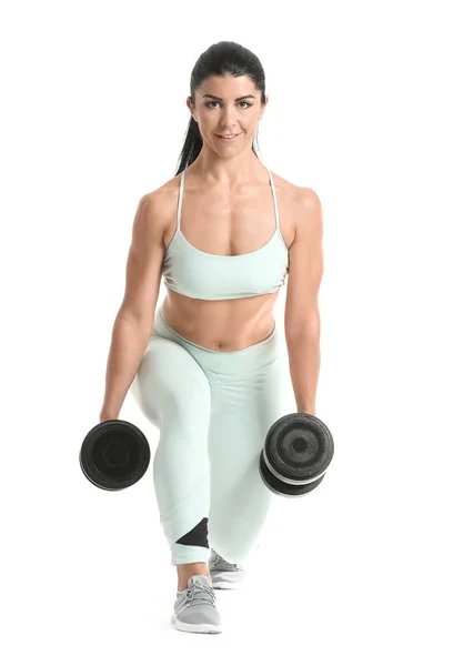 Mulher muscular desportiva com halteres isolados em branco — Fotografia de Stock