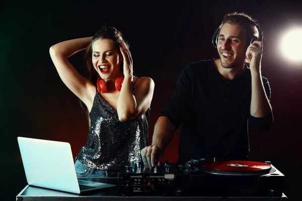 Young djs playing music in nightclub — Stock Photo, Image