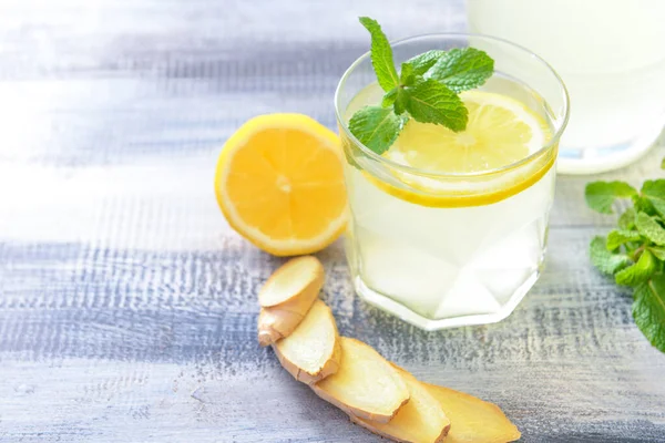 Glass of tasty lemonade on wooden background — Stock Photo, Image