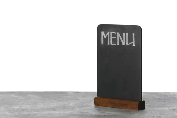 Menu em branco na mesa contra fundo branco — Fotografia de Stock