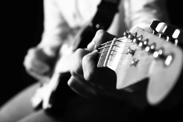 Black and white photo of man with guitar, closeup — Stock Photo, Image