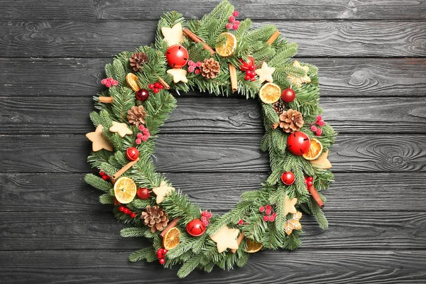 Beautiful Christmas wreath on wooden background — Stock Photo, Image
