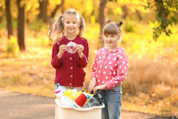 Little children collecting trash outdoors. Concept of recycling — Stock Photo, Image