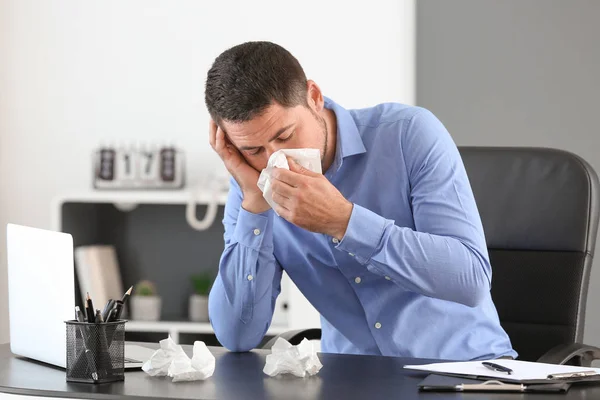 Man ill with flu working in office