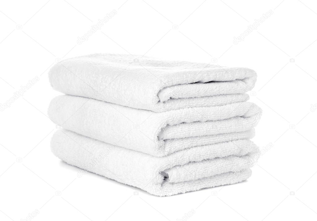 Stack of clean towels isolated on white