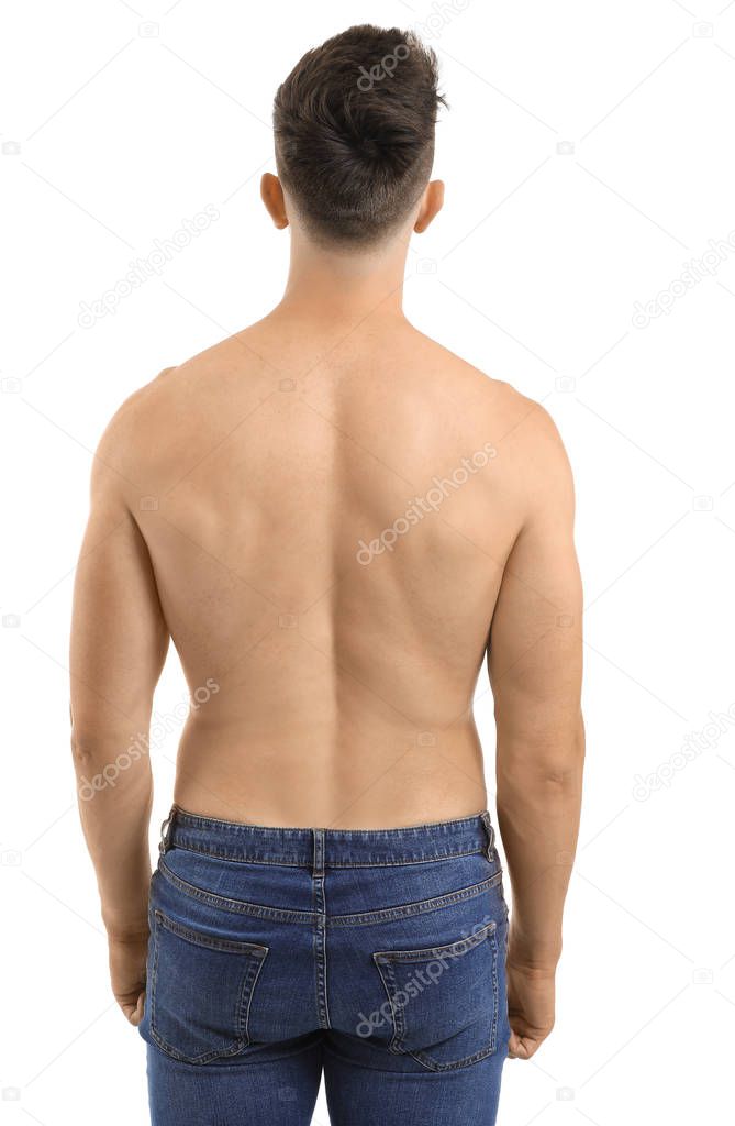 Young man with naked torso on white background, back view