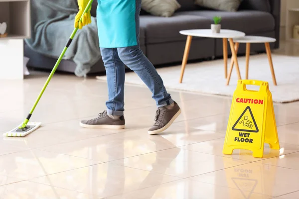 stock image Male janitor mopping floor in flat